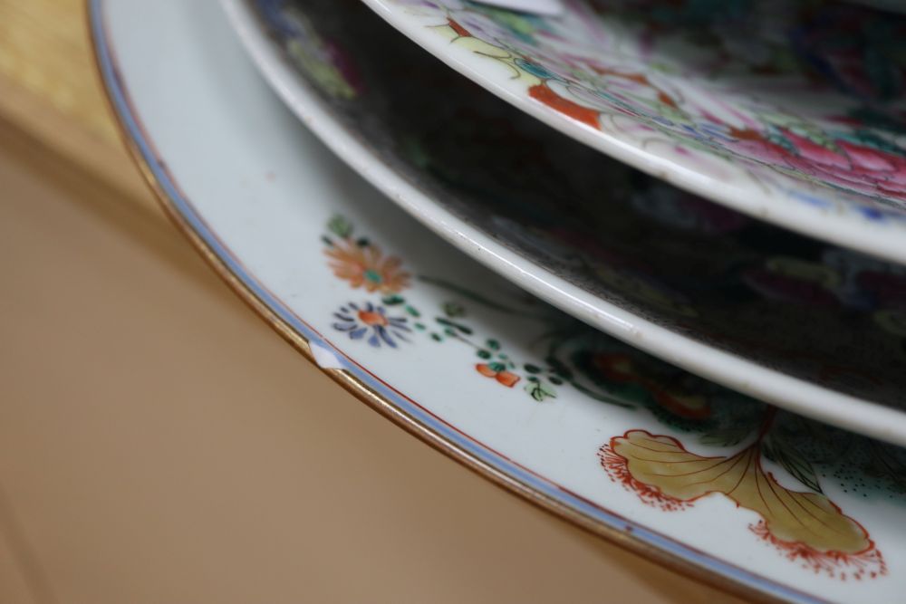 A collection of Oriental chargers and plates,
